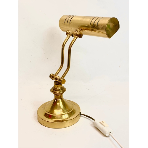 196 - A brass desk lamp. Highest 38cm