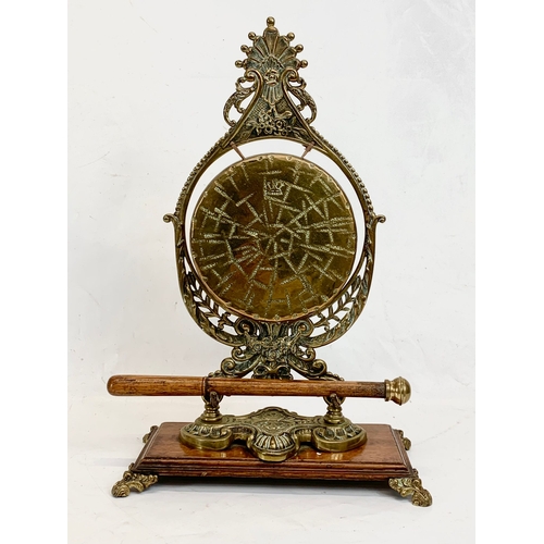 210 - A late Victorian ornate brass gong on oak stand. Circa 1890-1900. 29 x 43cm