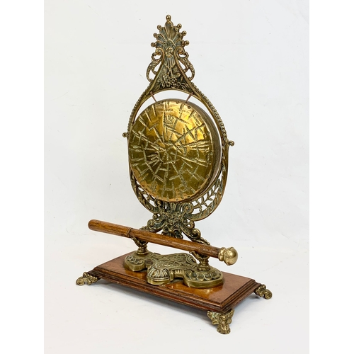 210 - A late Victorian ornate brass gong on oak stand. Circa 1890-1900. 29 x 43cm