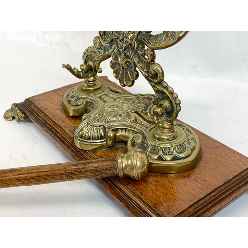 210 - A late Victorian ornate brass gong on oak stand. Circa 1890-1900. 29 x 43cm