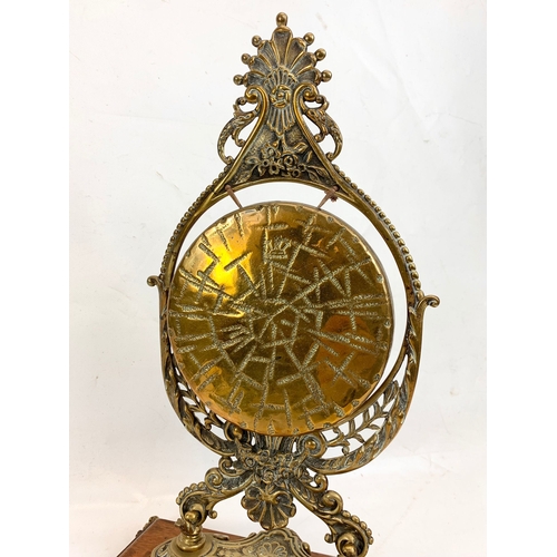 210 - A late Victorian ornate brass gong on oak stand. Circa 1890-1900. 29 x 43cm