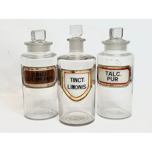 212 - A set of 3 large early 20th century chemist bottles. 21cm