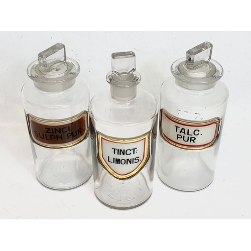 212 - A set of 3 large early 20th century chemist bottles. 21cm