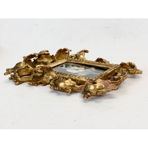 213 - A late Victorian ornate gilt frame. 24 x 30cm