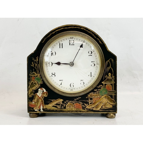 215 - An early 20th century chinoiserie mantle clock with key. French works. 13 x 14cm