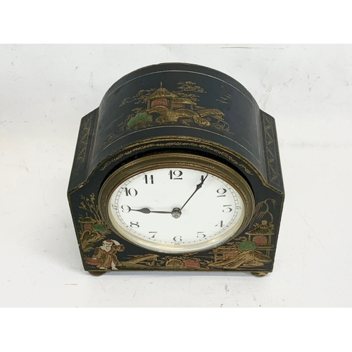 215 - An early 20th century chinoiserie mantle clock with key. French works. 13 x 14cm