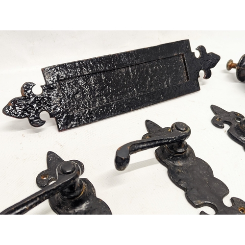 225 - A quantity of early 20th century cast iron door furniture.