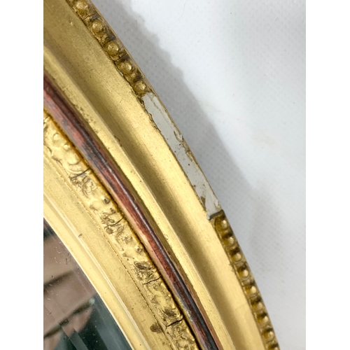 255 - A Victorian ornate gilt framed mirror. Circa 1880. 52 x 69cm