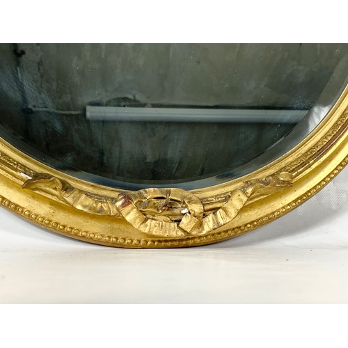 255 - A Victorian ornate gilt framed mirror. Circa 1880. 52 x 69cm