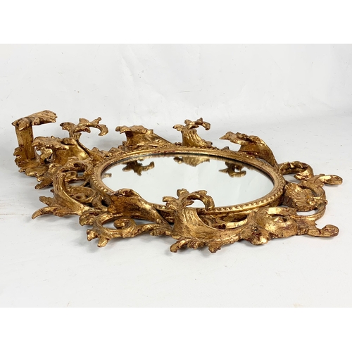 256 - A Victorian ornate gilt framed mirror. Circa 1860. 44 x 56cm