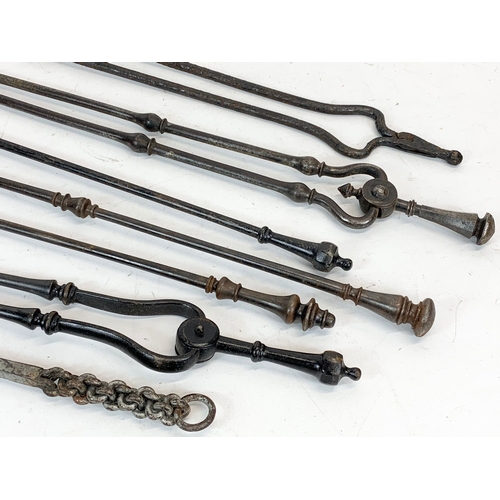 264 - A quantity of 19th century fire tools. 75cm