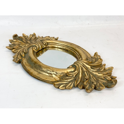 271 - A modern ornate gilt framed mirror 26 x 52cm