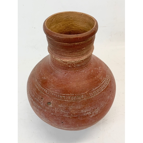 277 - An early 20th century Indian terracotta pot and a Marai terracotta pot. 29cm