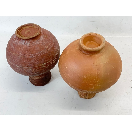 277 - An early 20th century Indian terracotta pot and a Marai terracotta pot. 29cm