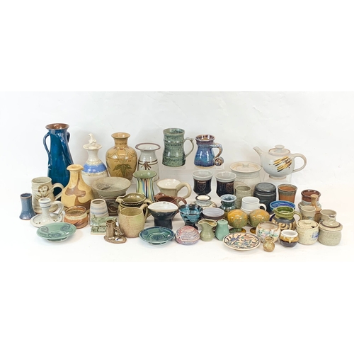 573 - A large collection of mostly signed Studio Pottery.