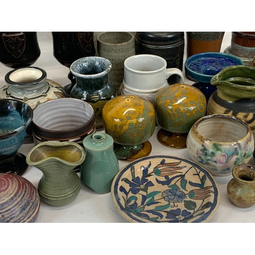 573 - A large collection of mostly signed Studio Pottery.