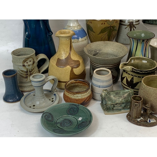 573 - A large collection of mostly signed Studio Pottery.