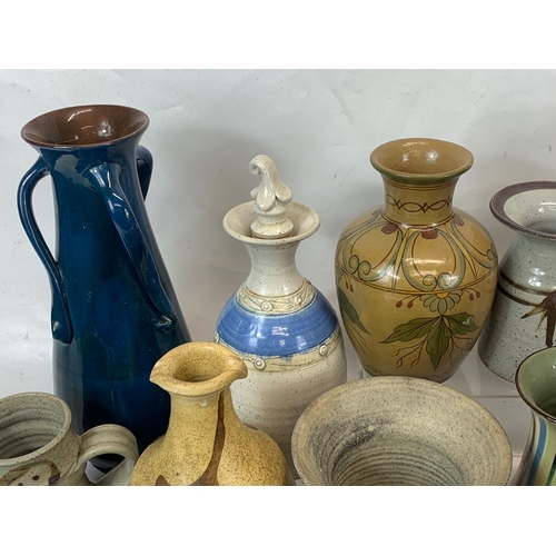 573 - A large collection of mostly signed Studio Pottery.