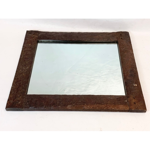 292 - A late 19th, early 20th century oak framed mirror. 60 x 52cm