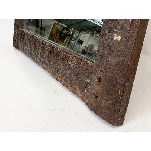 292 - A late 19th, early 20th century oak framed mirror. 60 x 52cm