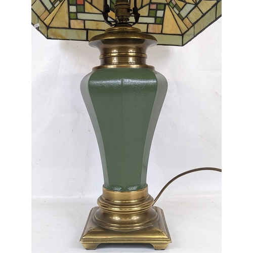 321 - A Tiffany style lamp. The shade measures 36x24cm.