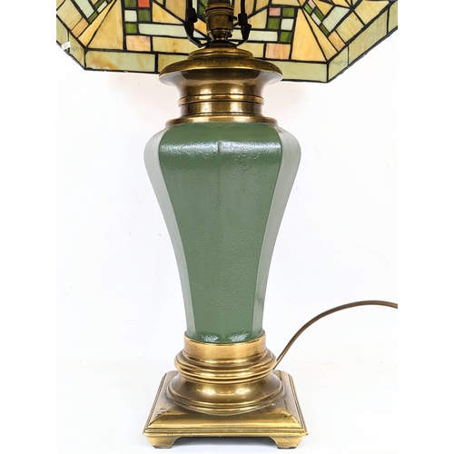 321 - A Tiffany style lamp. The shade measures 36x24cm.