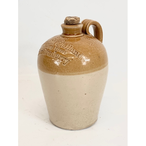 339 - 2 early 20th century copper jugs, a chemist bottle and a vintage stone flagon. 22cm