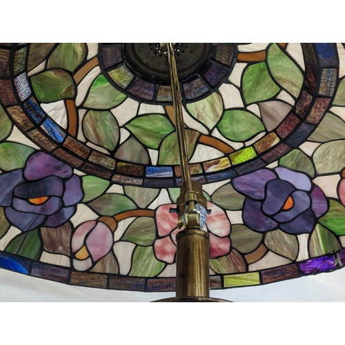 341 - A large Tiffany style lamp. Shade measures 63x23cm