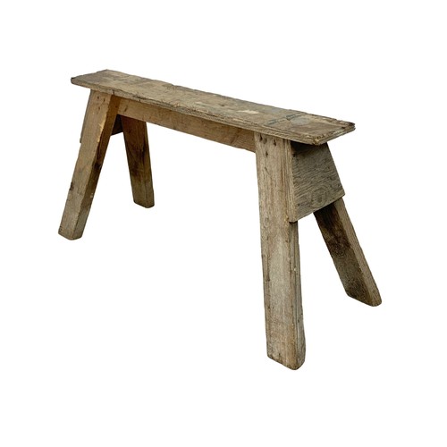 57 - A vintage pine trestle stool. 86cm