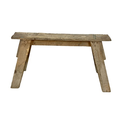 57 - A vintage pine trestle stool. 86cm