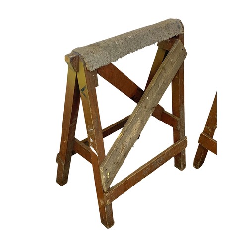 58 - A pair of large early 20th century pine trestle stands with original paint. 78 x 92.5cm