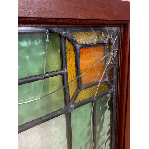 194 - A pair of Victorian stained glass panels in frame. 62.5 x 69cm