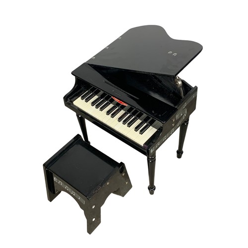 270 - A miniature Melissa & Doug grand piano and stool. 50.5 x 55 x 50cm