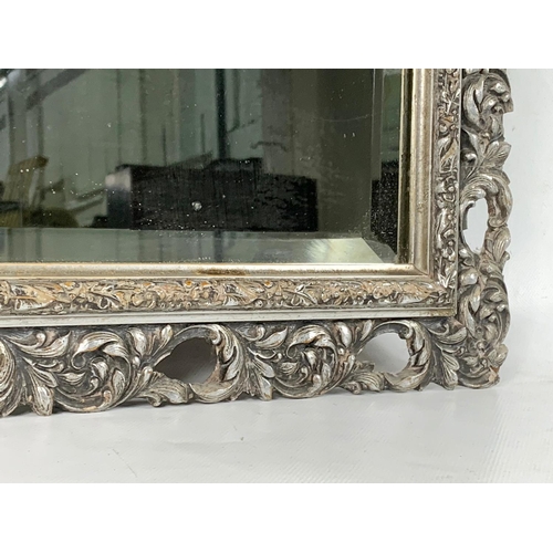 354 - A Victorian ornate gilt framed mirror. 49 x 60cm