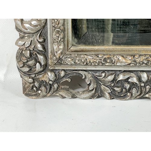 354 - A Victorian ornate gilt framed mirror. 49 x 60cm