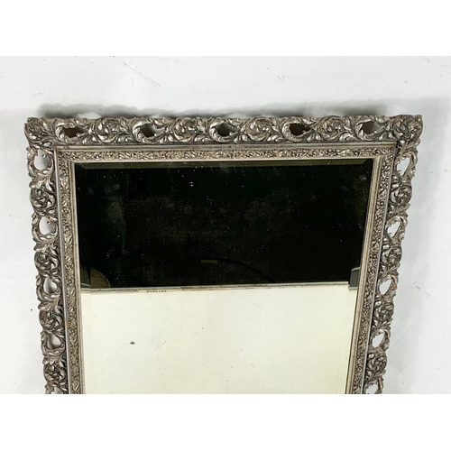 354 - A Victorian ornate gilt framed mirror. 49 x 60cm