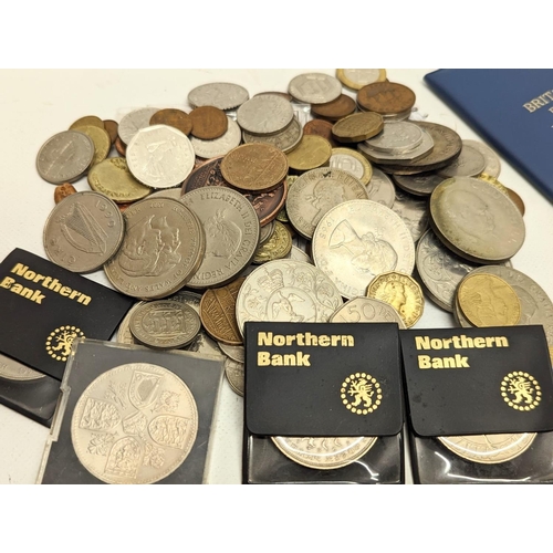 368 - A quantity of coins, British and International, including a 10 shilling note.