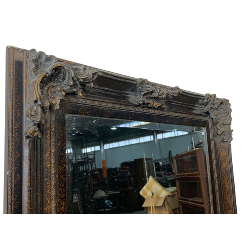 383 - A large ornate gilt framed mirror. 83 x 143cm