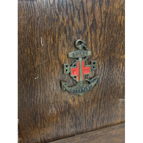 385C - A small oak lectern and a Boys Brigade sign.