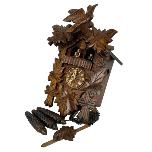 233A - Vintage cuckoo clock with weights and pendulum. 24 x 37cm.