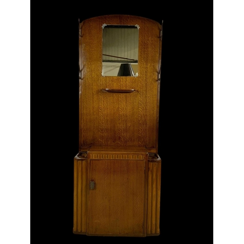 1147 - An Art Deco walnut hallstand by Lebus Furniture. Circa 1950. 69x28x170cm