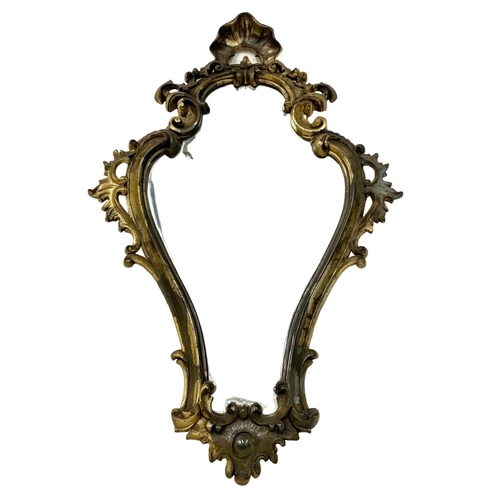 322 - An ornate gilt plastic framed mirror. 48 x 71cm.