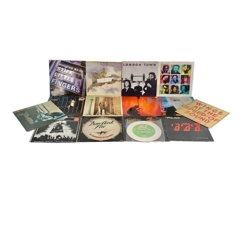 63 - A collection of LP, Vinyl Records. Including Budgie, Wings London Town, Wings At The Speed of Sound,... 