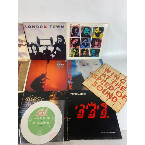 63 - A collection of LP, Vinyl Records. Including Budgie, Wings London Town, Wings At The Speed of Sound,... 