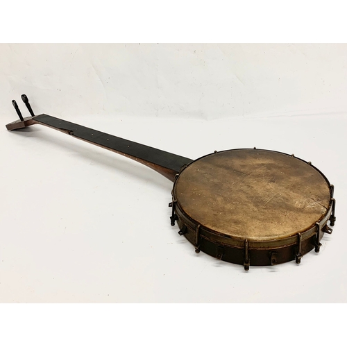 324 - A late 19th century rosewood banjo. 88cm