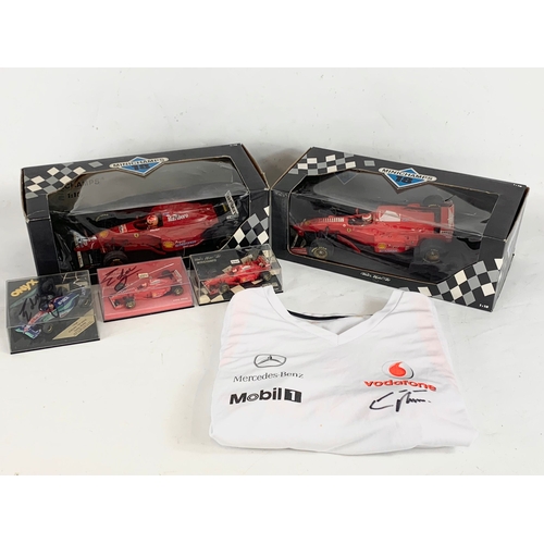 252U - A collection of signed model racing cars by Eddie Irvine. Minichamps model cars and signed Mercedes-... 