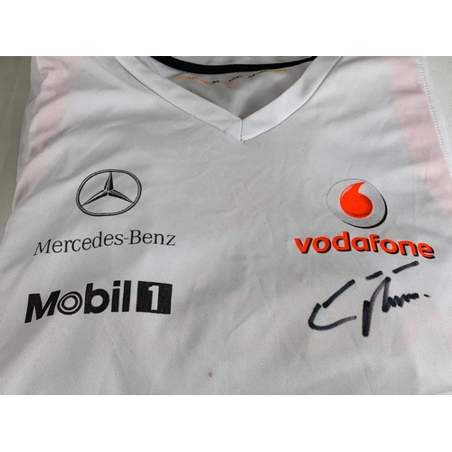 252U - A collection of signed model racing cars by Eddie Irvine. Minichamps model cars and signed Mercedes-... 