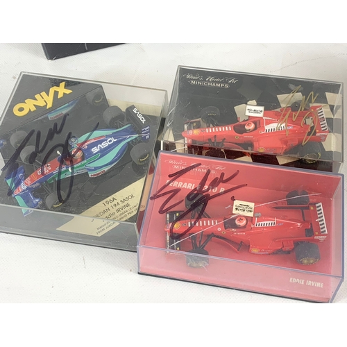 252U - A collection of signed model racing cars by Eddie Irvine. Minichamps model cars and signed Mercedes-... 