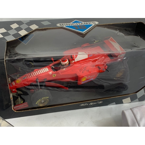 252U - A collection of signed model racing cars by Eddie Irvine. Minichamps model cars and signed Mercedes-... 