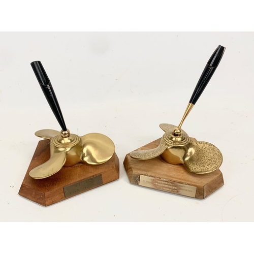 112 - A pair of Parker Pen stands. Inscribed. 13 x 15cm